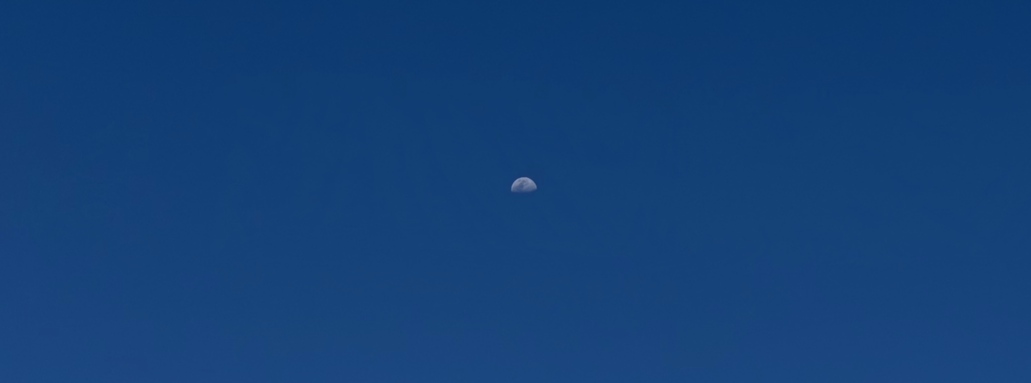 Moon on a deep blue sky